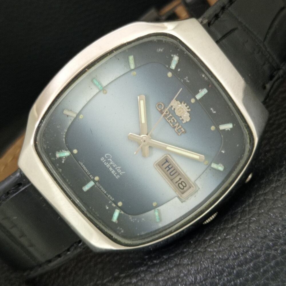Vintage 1974 Orient Automatic Mens Silver Watch W/daydate & Blue accents
